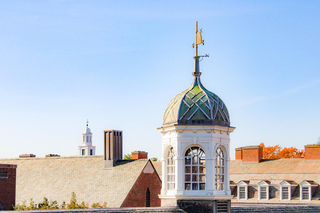 A tower with a weather vane