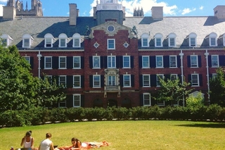 Students studying during spring time at the Davenport Courtyard