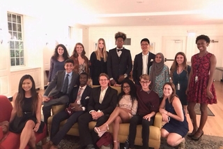 group of people dressed for a formal